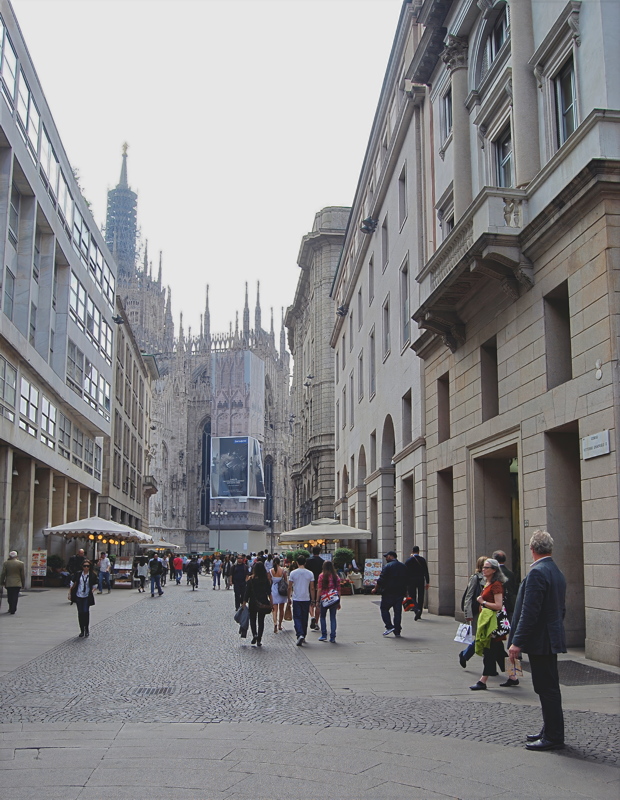 14 - A view looking down Corso Vittorio Emanuele II towards the iconic Milan Cathedral (Duomo di Milano) in the background in Milan